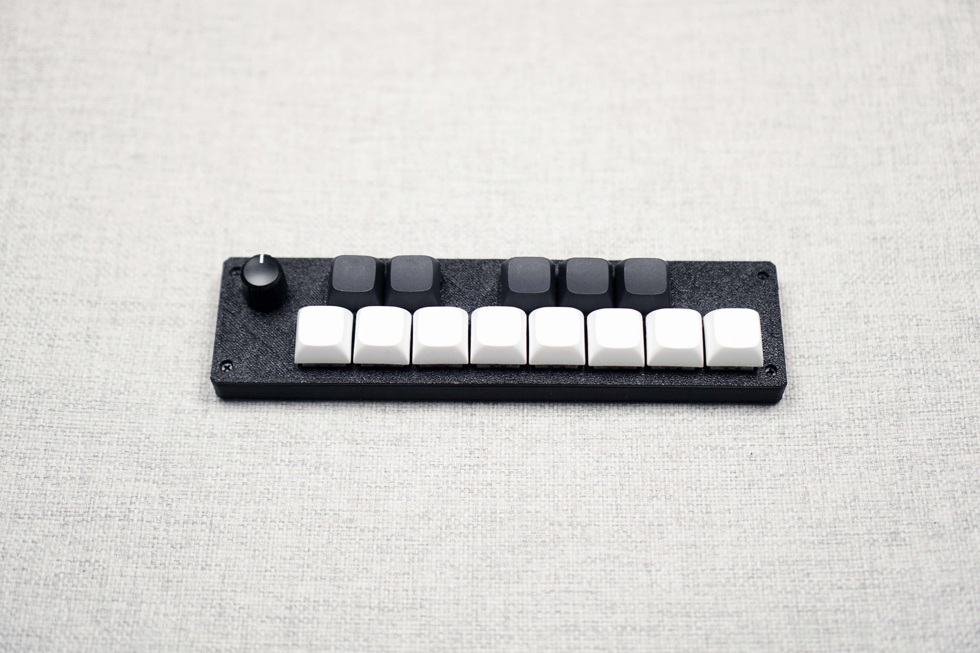 The 13KS-1ES seen from the front, the whole one-octave layout sitting in one slim black body